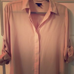 Light pink button down shirt. Business casual.